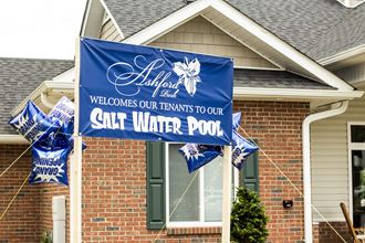 a sign in front of a house that says salt water pool