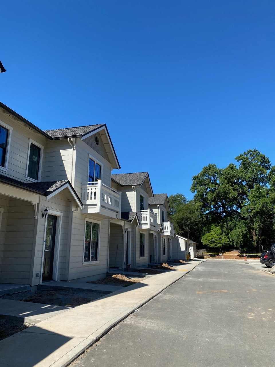 a row of houses on the side of a street