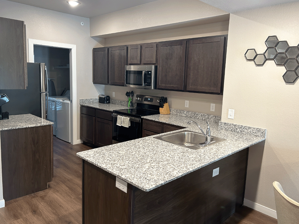 a kitchen with a granite counter top and a sink
