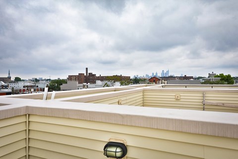 the view of the city from the roof of a building
