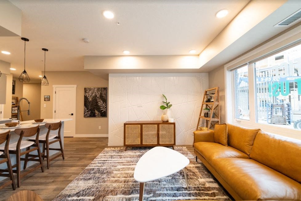 a living room and dining room with a couch and a table