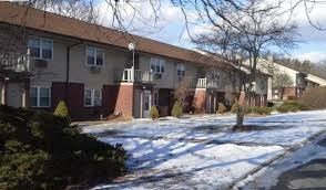 an image of an apartment building in the snow