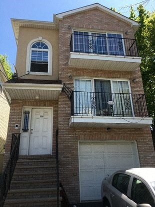 a house with a car parked in front of it