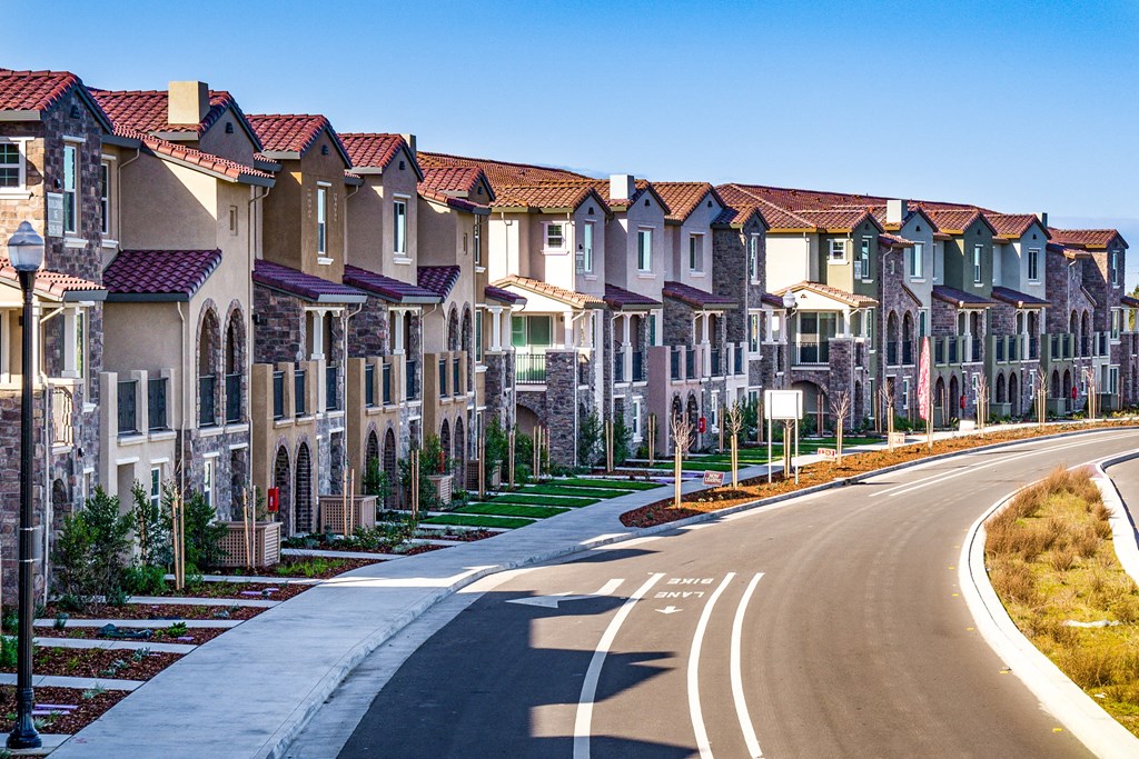 a street in front of a row of houses