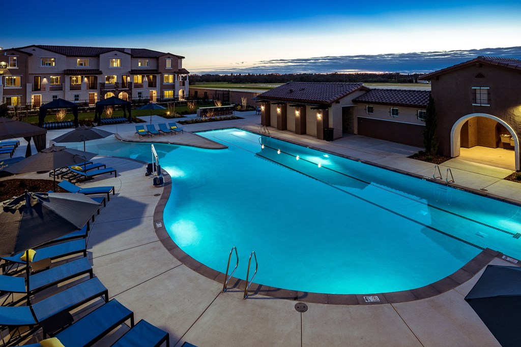 an aerial view of a swimming pool at dusk at the resort at governors crossing