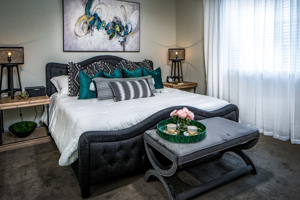 a bedroom with a bed and a coffee table