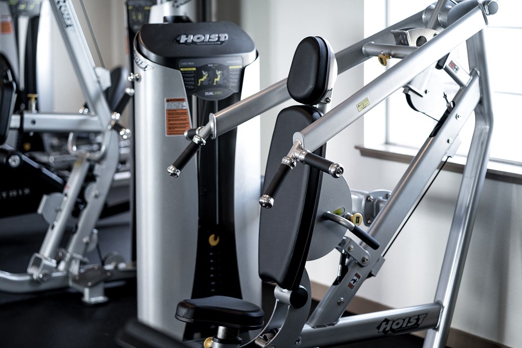 a row of exercise bikes in a gym