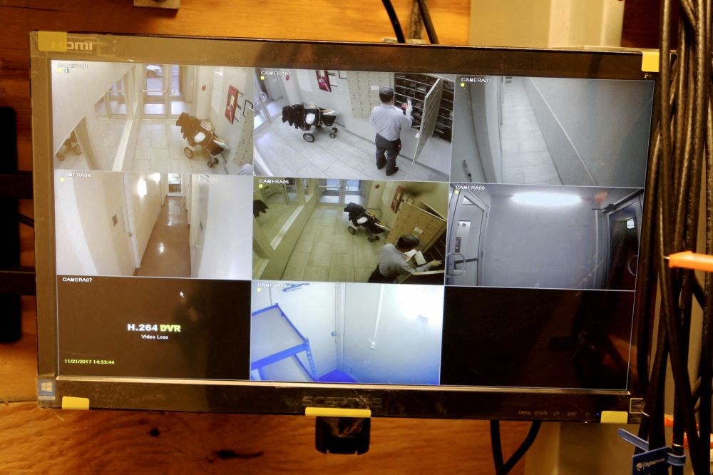 a computer screen showing pictures of people in a room