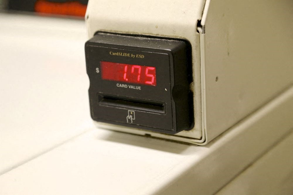 a digital alarm clock sitting on a white table