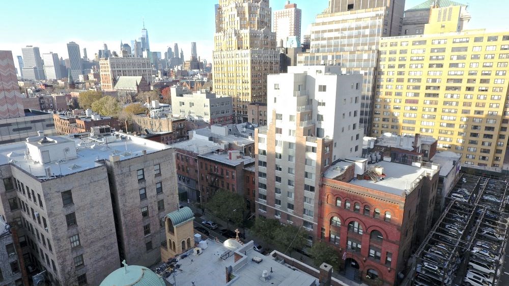 a view of the city from the roof of a building