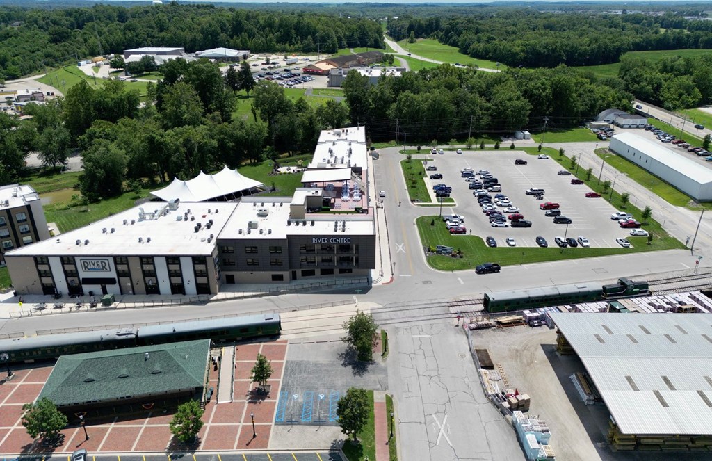 an aerial view of a parking lot and buildings in a city
