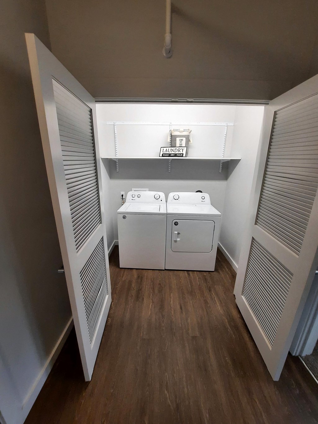 a laundry room with two washes and a dryer in it