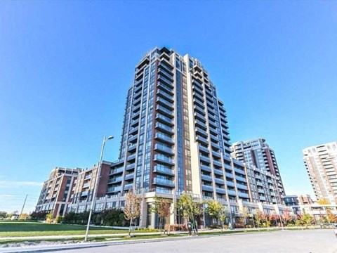 an apartment building on the side of a street