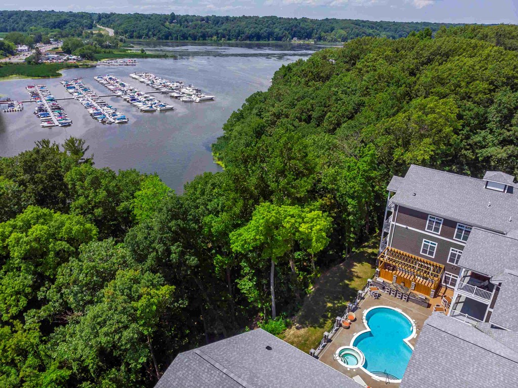 a view of a pool and a marina from a roof