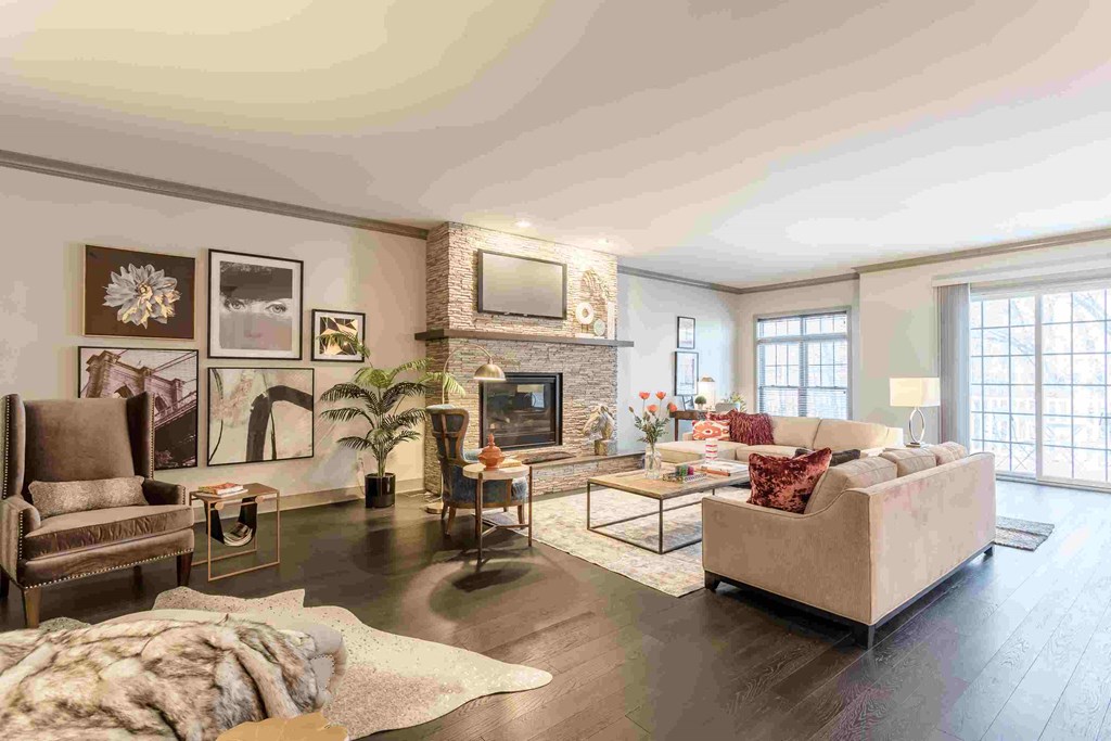 a living room with a fireplace and couches
