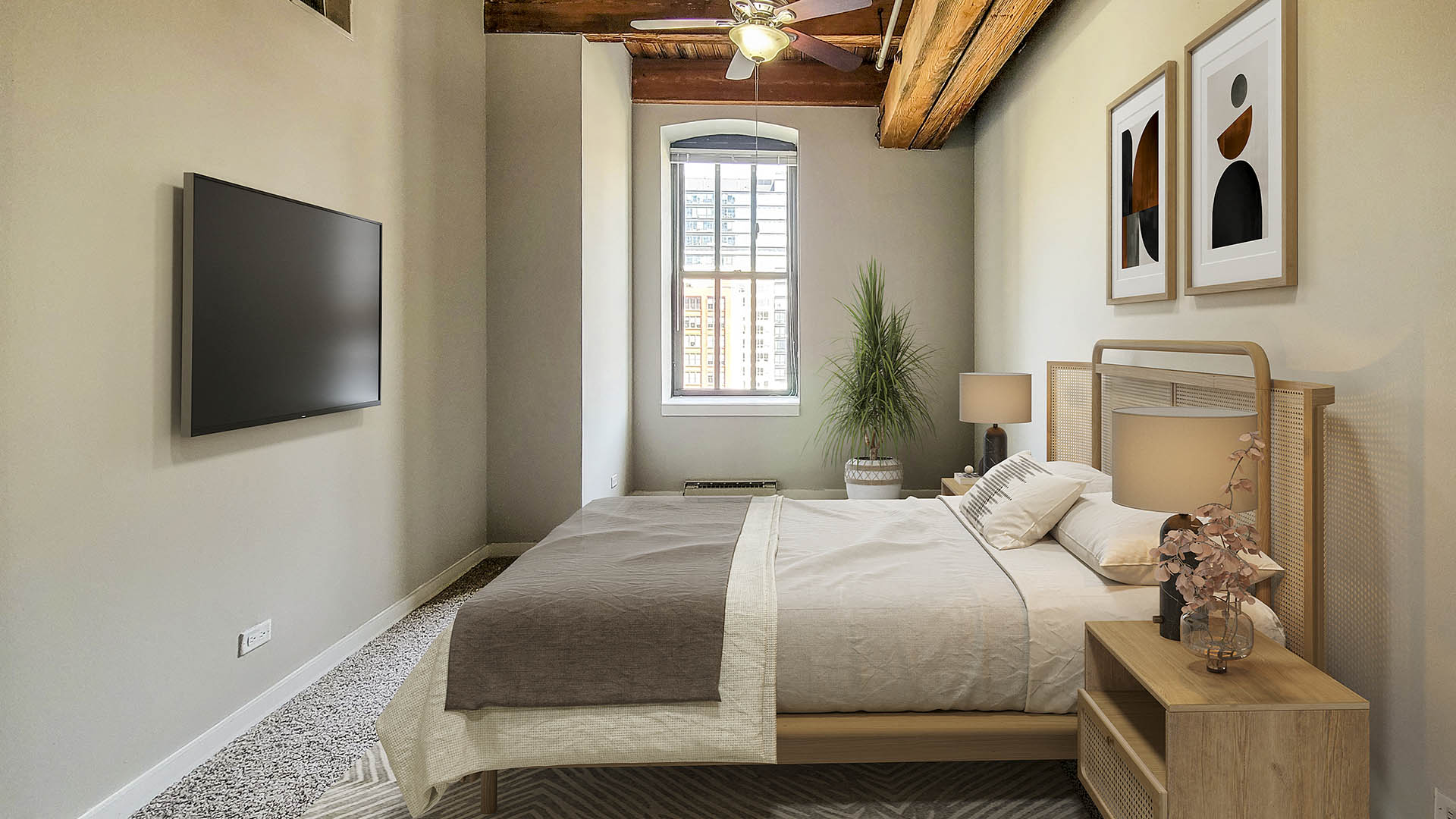 a bedroom with a bed and a tv in the corner