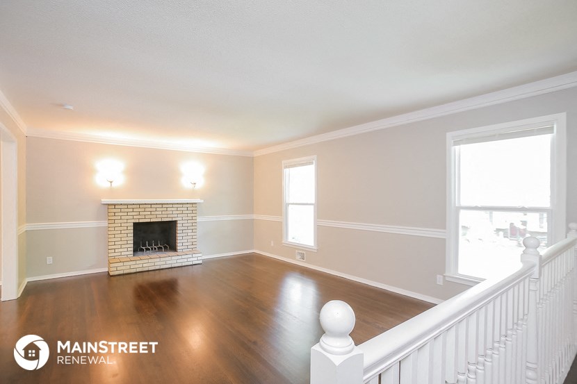 the living room of a house with a fireplace