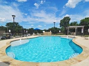 a large pool of water in a resort pool