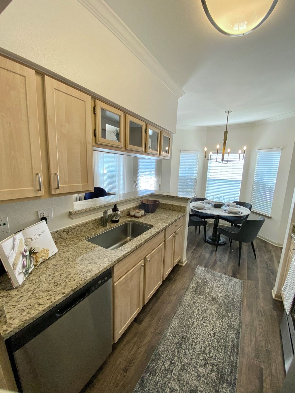 an open kitchen and dining room with a table and chairs