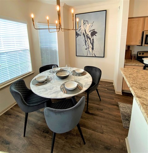 a dining room with a table and chairs