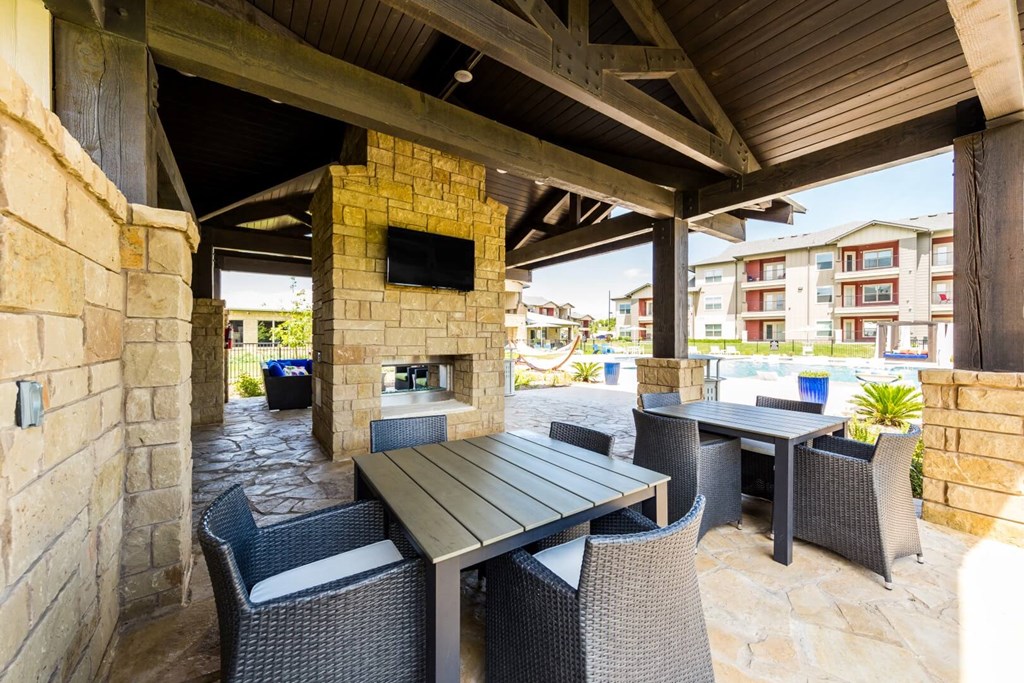 Lounge Area with Fireplace and BBQ Area at Legacy Creekside Apartments, San Antonio, Texas