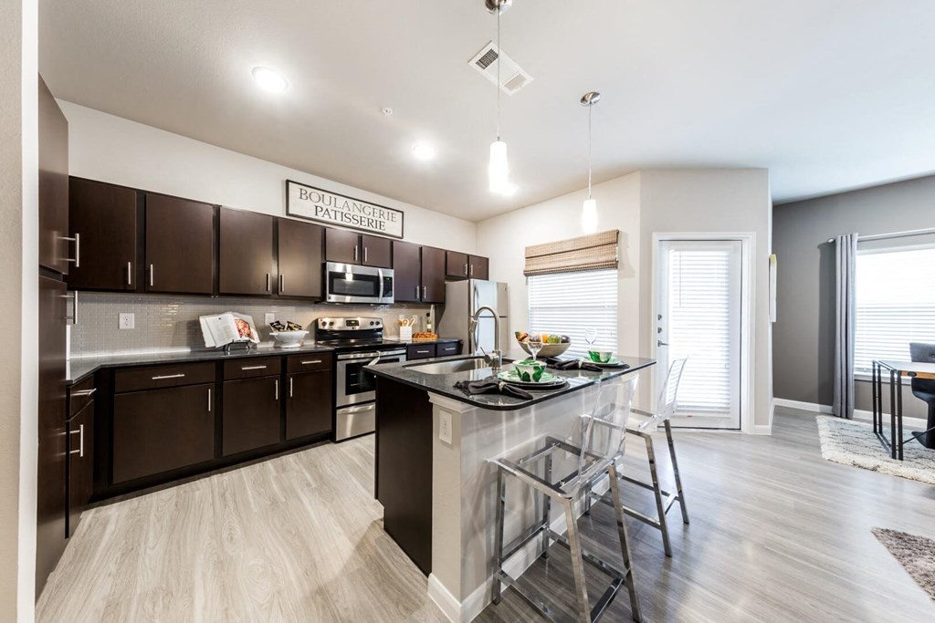 Model 2 - Open Floor Plan with Kitchen Island & Private Patio at Legacy Creekside Apartments, San Antonio, TX