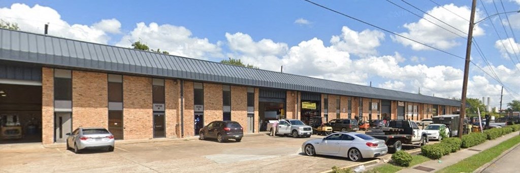 a building with cars parked in front of it