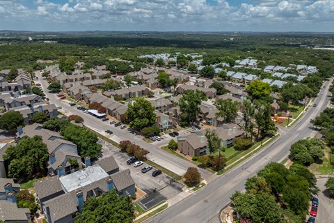 A suburban neighborhood with houses and trees.