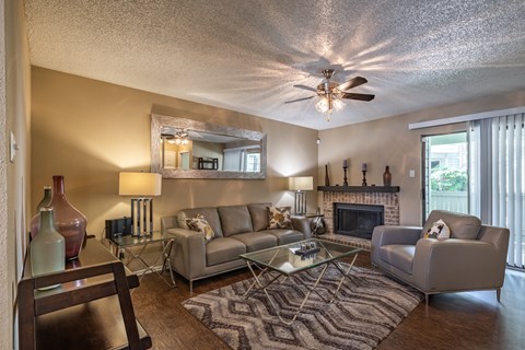 A living room with a fireplace and a couch.