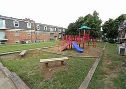 a park with a playground and a bench