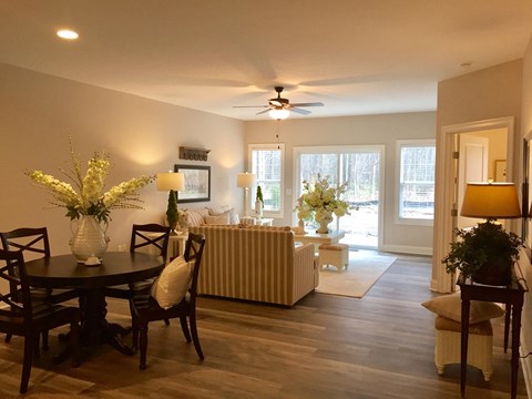 the view of the living room and dining room from the kitchen