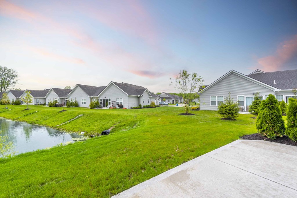 a row of houses next to a body of water