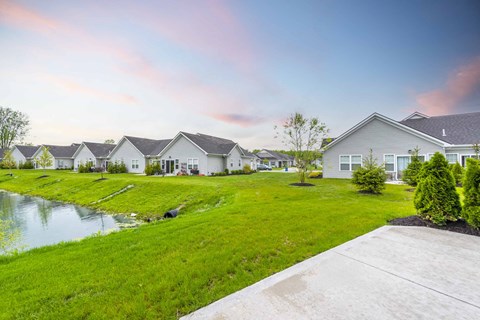 a row of houses next to a body of water