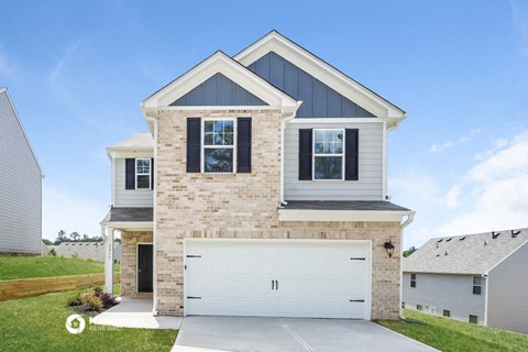 a house with a white garage door in front of it