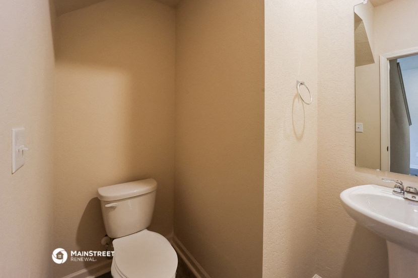 a bathroom with a toilet and a sink