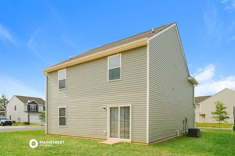 the outside of a house with a grey siding