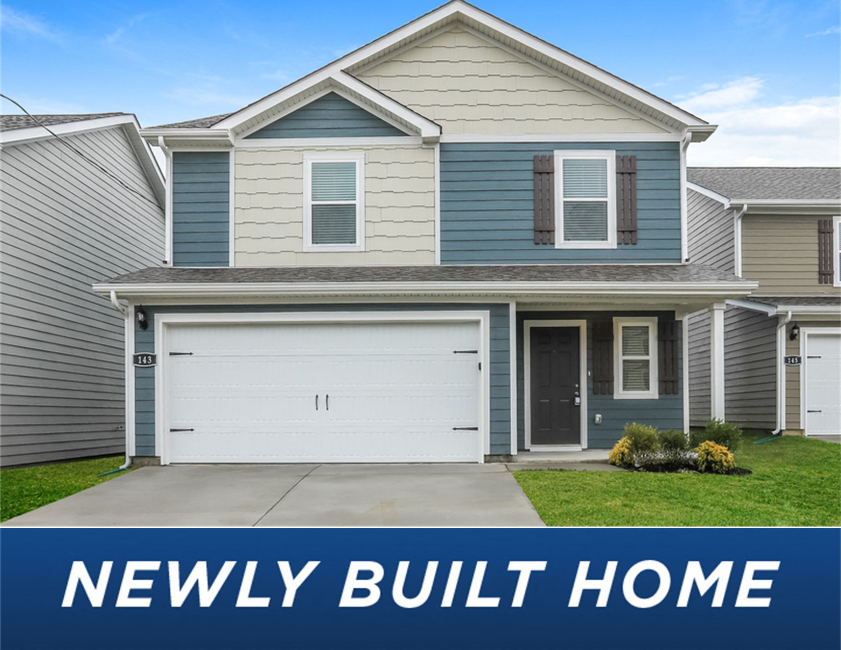 a blue and white house with a white garage door