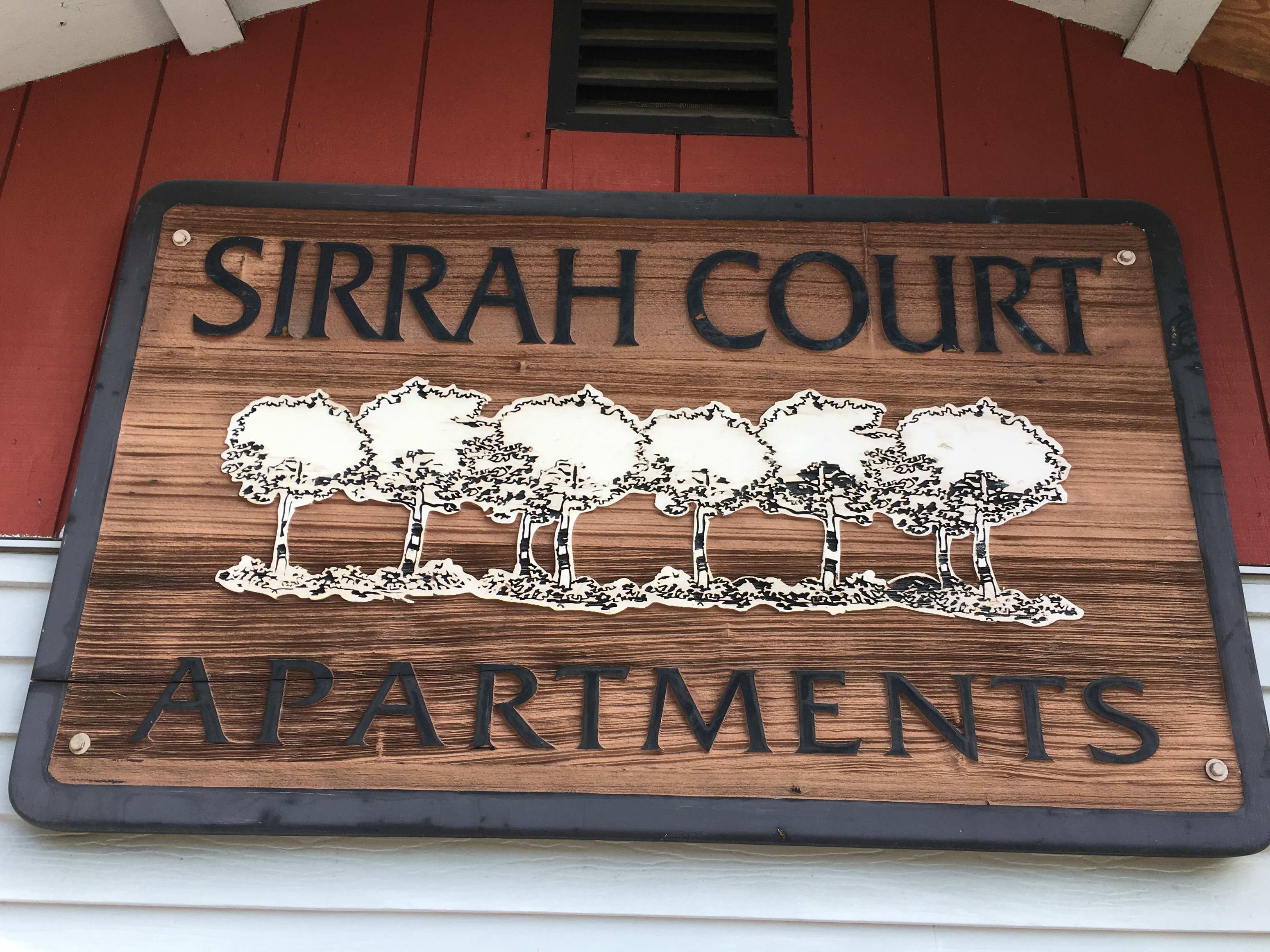 a sign for the strain court apartments