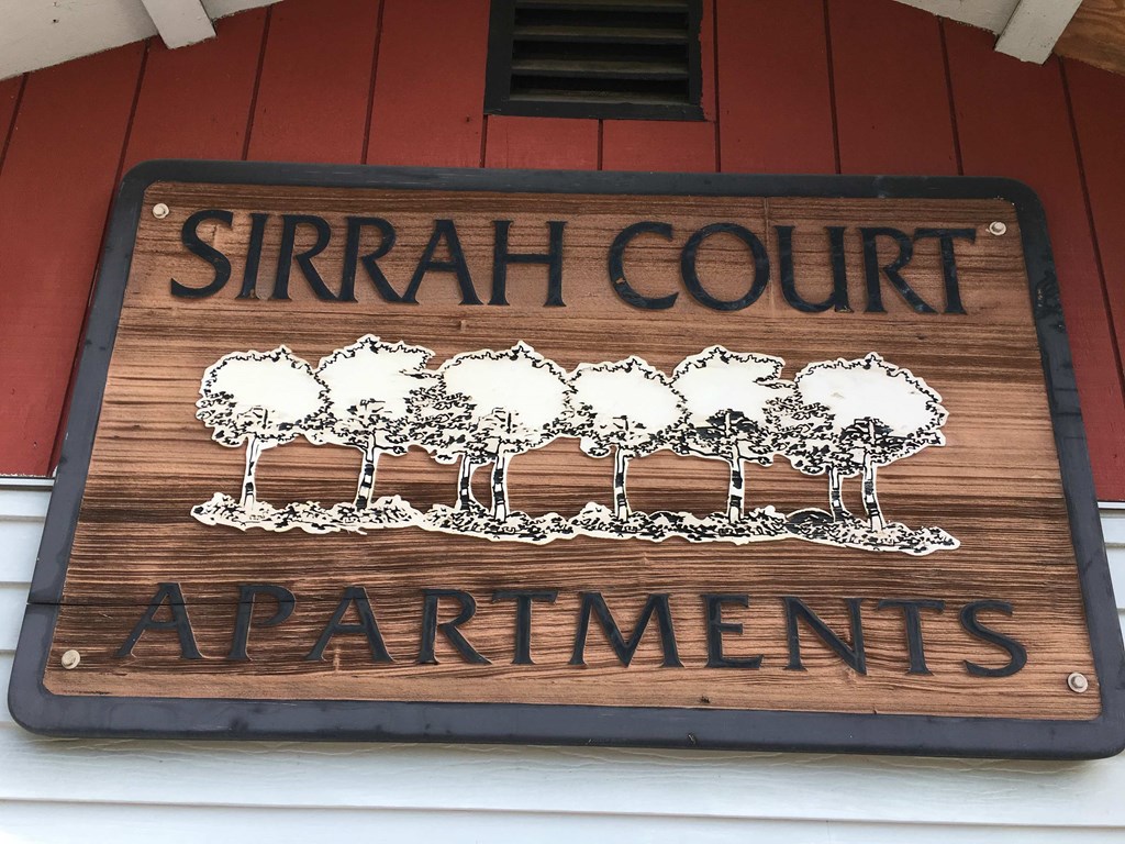 a sign for the strain court apartments