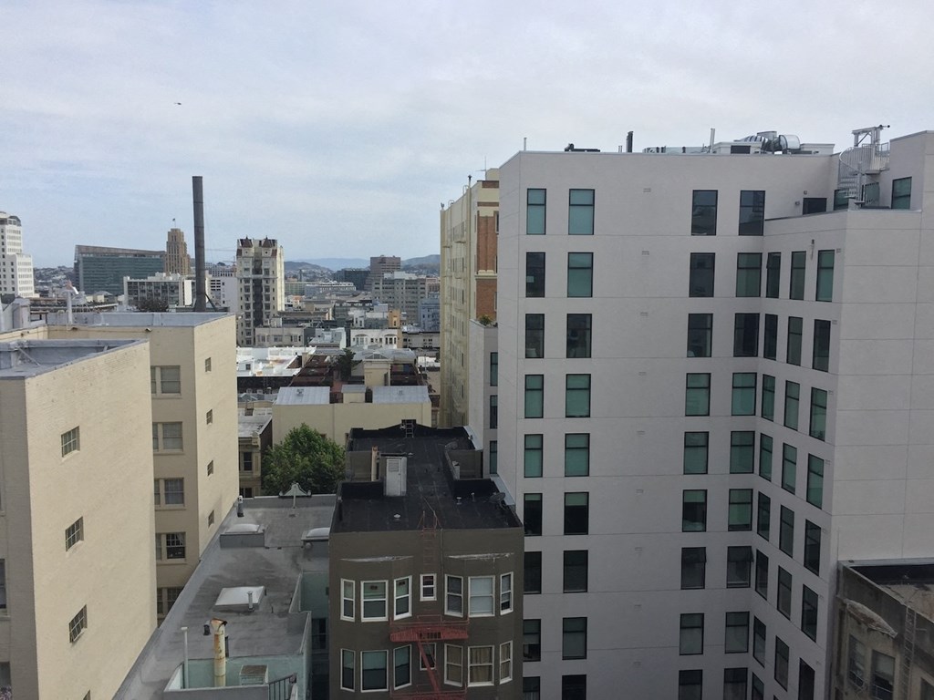 a view of the city from the roof of a building