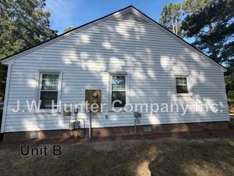 A white building with J.W. Hunter Company Inc. written on it.