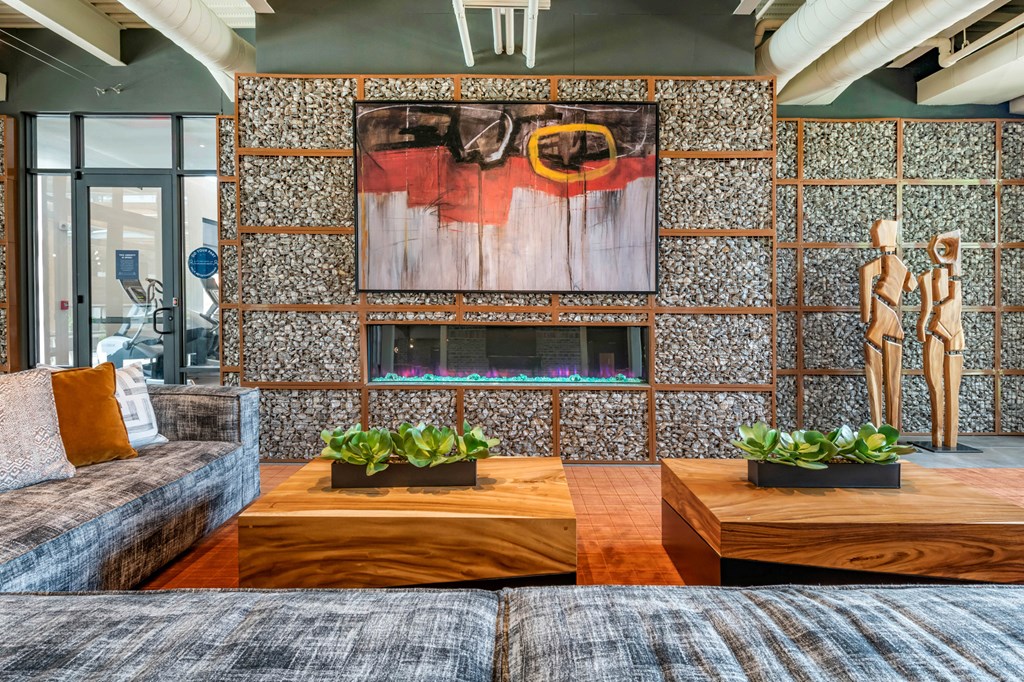 Couch and table with tv at JTB Apartments, Florida, 32256