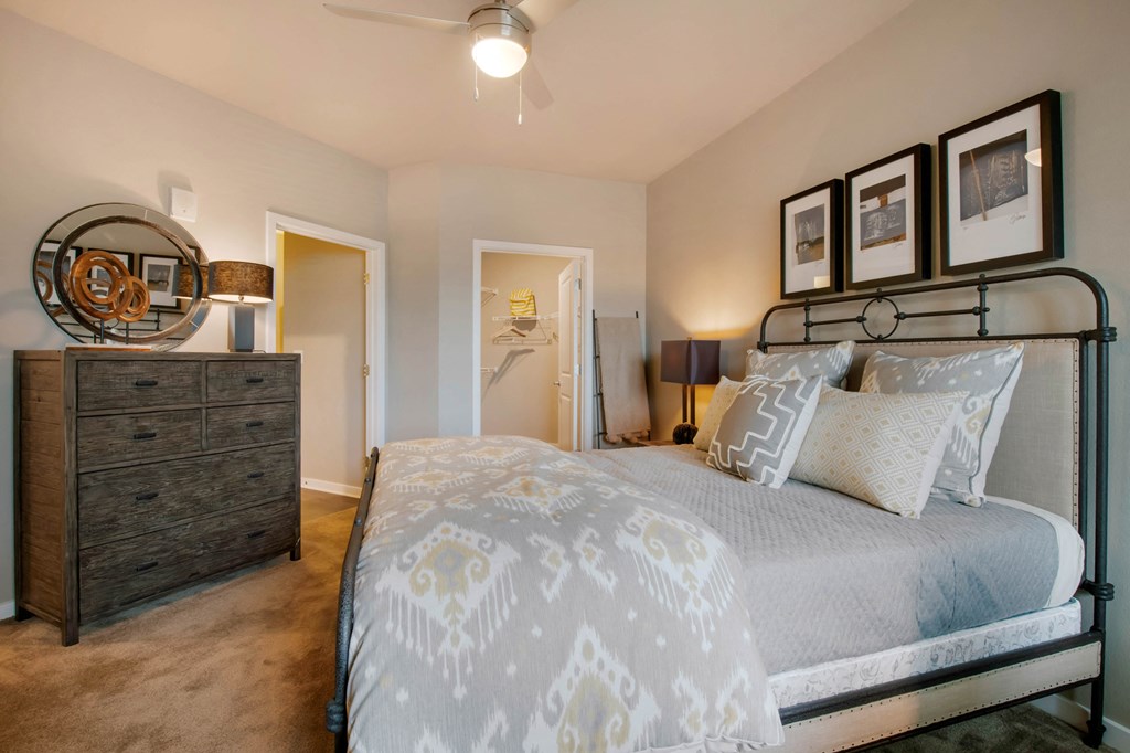 Large Bedrooms with cozy bed and lamp at JTB Apartments, Jacksonville, Florida