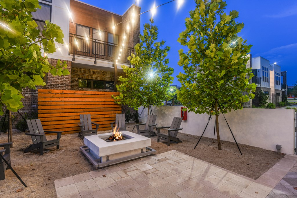 Living area outdoor at night at JTB Apartments, Jacksonville, FL