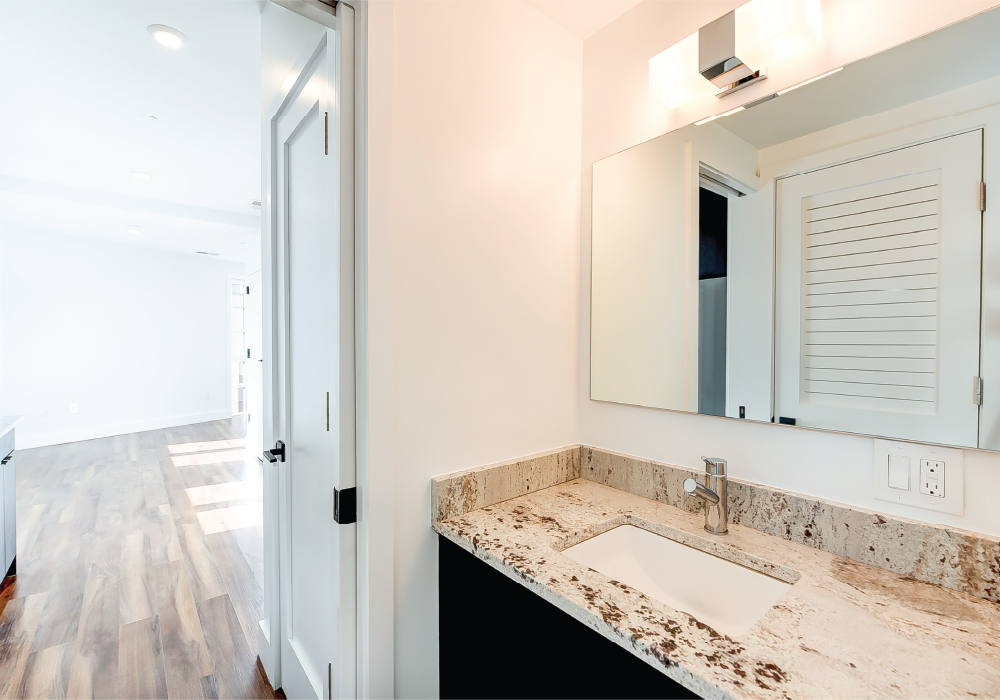 a bathroom with a sink and a mirror