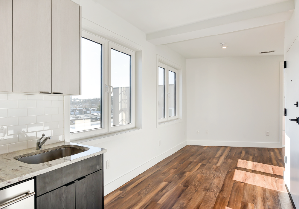 a kitchen with a sink and a window
