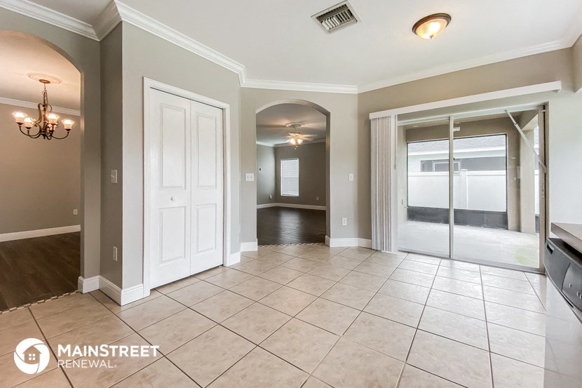 the living room and dining room are open to the hallway and kitchen