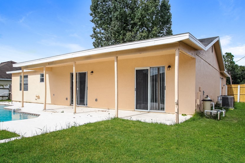 a house with a yard and a pool