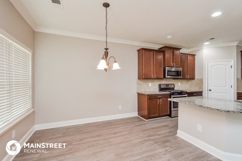 the kitchen and dining area of a renovated house