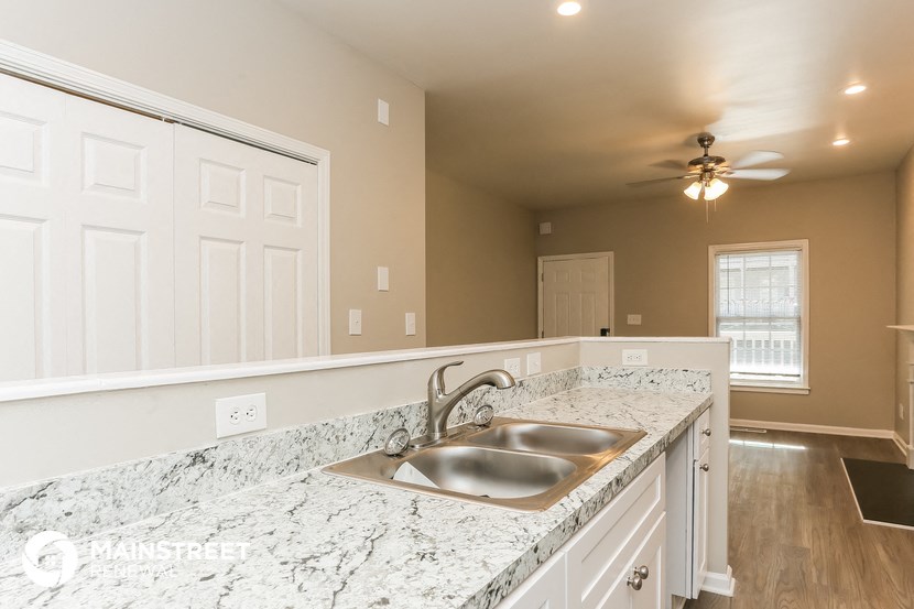 a kitchen with granite counter tops and a sink
